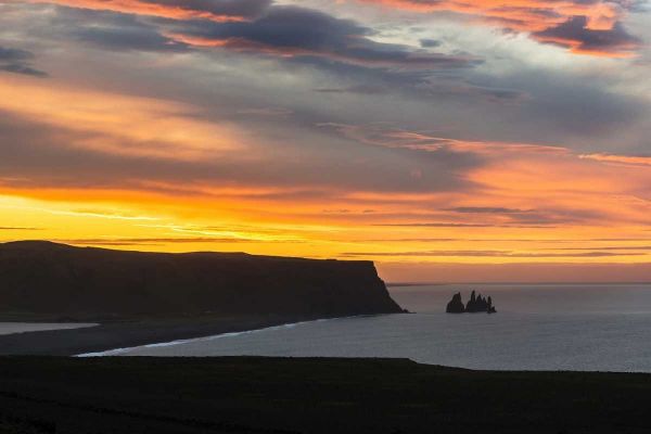 Iceland, Dyrholaey Sunrise over ocean and land